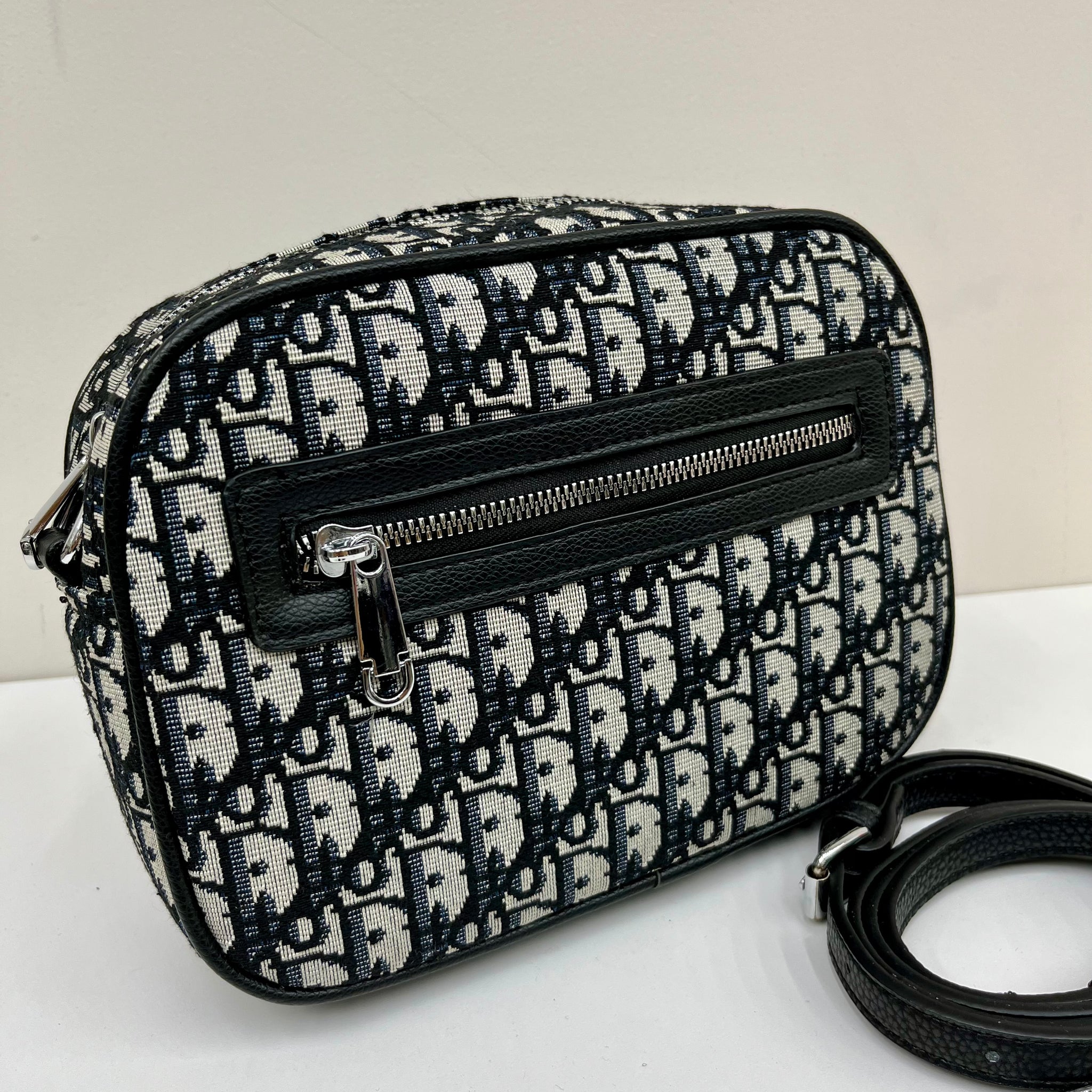 D bigger camera bag zip front detail with cross body strap